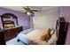 Bedroom with carpet, a ceiling fan, and a double door closet at 211 Hunt St, Clermont, FL 34711