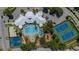 Aerial view showcasing a pool, tennis courts, a basketball court, playground, and community gathering spaces at 2304 Silver Palm Dr # 304, Kissimmee, FL 34747