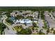 Stunning aerial view of a community featuring a large pool, clubhouse, tennis courts, and beautiful landscaping at 2304 Silver Palm Dr # 304, Kissimmee, FL 34747