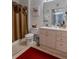 A well-lit bathroom features a vanity with good storage and decorative accents that complement the space at 2304 Silver Palm Dr # 304, Kissimmee, FL 34747