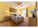 A comfortable bedroom boasts a large window, providing natural light and a relaxing ambiance at 2304 Silver Palm Dr # 304, Kissimmee, FL 34747