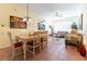 Open-concept dining area with a view of the living room, kitchen, and tiled floors at 2304 Silver Palm Dr # 304, Kissimmee, FL 34747