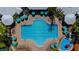 Aerial view of a swimming pool with ample seating and umbrellas for a relaxing day in the sun at 2304 Silver Palm Dr # 304, Kissimmee, FL 34747