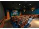 Movie theater room with comfortable seating, a projector, and a large screen for viewing films at 2304 Silver Palm Dr # 304, Kissimmee, FL 34747