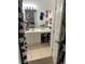 Bathroom with white vanity and a large mirror above the sink at 2882 Club Cortile Cir # B, Kissimmee, FL 34746
