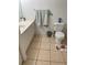 A clean bathroom with a toilet and a sink vanity at 2882 Club Cortile Cir # B, Kissimmee, FL 34746