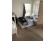 A cozy bedroom with a comfortable bed and natural light streaming in from the window at 2882 Club Cortile Cir # B, Kissimmee, FL 34746