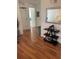 Hallway showcasing wood floors, decorative accents, and doorways leading to various rooms in the home at 2882 Club Cortile Cir # B, Kissimmee, FL 34746