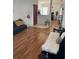 Inviting living room with hardwood floors, a stylish black sofa, and a cozy faux fur throw at 2882 Club Cortile Cir # B, Kissimmee, FL 34746