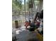 The porch is cluttered and has items placed around at 2882 Club Cortile Cir # B, Kissimmee, FL 34746