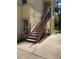 Exterior view of a building featuring a red staircase leading to the upper levels, offering convenient access at 2882 Club Cortile Cir # B, Kissimmee, FL 34746