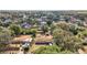Aerial view of property highlighting surrounding neighborhood with mature trees, serene atmosphere, and generous lot size at 2921 Bon Air Dr, Orlando, FL 32818