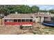 A fenced backyard features a grill, picnic table, and trampoline on a spacious lot at 2921 Bon Air Dr, Orlando, FL 32818