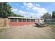 Spacious backyard with brick exterior, screened in patio, grill, and trampoline perfect for Gathering gatherings and outdoor fun at 2921 Bon Air Dr, Orlando, FL 32818