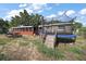 Expansive backyard featuring a trampoline, barbecue, picnic table, and partially screened-in patio, ideal for entertaining at 2921 Bon Air Dr, Orlando, FL 32818