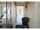 Inviting front entrance with a white door, welcome decor, and a sleek baby stroller, creating a warm and Gathering-friendly atmosphere at 2921 Bon Air Dr, Orlando, FL 32818