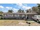Charming single-story home featuring decorative shutters, neutral exterior, and well-lit front entrance, perfect for a welcoming ambiance at 2921 Bon Air Dr, Orlando, FL 32818