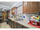 Kitchen featuring stainless steel sink, window, and wood cabinets at 2921 Bon Air Dr, Orlando, FL 32818