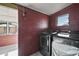 Laundry room with new washer and dryer units and view to backyard at 2921 Bon Air Dr, Orlando, FL 32818
