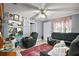 A cozy living room features tile floors and comfortable seating with neutral paint at 2921 Bon Air Dr, Orlando, FL 32818