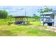 Lush backyard with a cozy seating area, perfect for relaxing and enjoying the outdoors at 2932 Larson St, Kissimmee, FL 34741