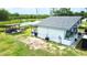 Exterior view of the home, revealing the backyard with patio and pond at 2932 Larson St, Kissimmee, FL 34741