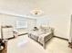 Cozy bedroom with neutral tones, hardwood floors, and a comfortable bed at 2932 Larson St, Kissimmee, FL 34741