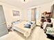 Bright bedroom featuring hard surface floors and a full-sized bed at 2932 Larson St, Kissimmee, FL 34741