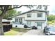 Charming two-story home with a modern exterior and well-maintained landscaping at 2932 Larson St, Kissimmee, FL 34741