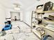 Spacious hallway featuring marble floors, modern lighting, and convenient access to storage and other rooms at 2932 Larson St, Kissimmee, FL 34741