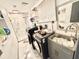 Well-equipped laundry room with modern washer and dryer, marble floors, and sink at 2932 Larson St, Kissimmee, FL 34741