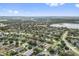 Aerial view highlighting the community's well-planned layout, featuring lush greenery and serene lake at 2950 Inca Ave, Clermont, FL 34715