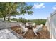 Backyard fire pit area with seating is perfect for relaxing and enjoying the outdoors at 2950 Inca Ave, Clermont, FL 34715