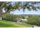 Beautiful backyard view overlooking the neighborhood, enhanced with lush landscaping and wrought iron fence at 2950 Inca Ave, Clermont, FL 34715