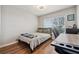 Comfortable bedroom with hardwood floors, a desk, and natural light at 2950 Inca Ave, Clermont, FL 34715