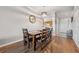 Dining room with hardwood floors and a view through to the kitchen at 2950 Inca Ave, Clermont, FL 34715