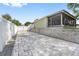 Large driveway features a paver stone design and offers ample parking space adjacent to the screened in porch at 2950 Inca Ave, Clermont, FL 34715