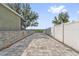 Long driveway featuring a paver stone design and leads to a backyard area, offering convenient access at 2950 Inca Ave, Clermont, FL 34715
