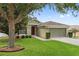 Charming home with mature landscaping, manicured lawn and covered front entryway at 2950 Inca Ave, Clermont, FL 34715
