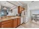 Neutral-toned kitchen with tile flooring, efficient layout, and stainless steel sink at 2950 Inca Ave, Clermont, FL 34715
