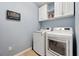 Convenient laundry room with washer, dryer, and storage cabinets at 2950 Inca Ave, Clermont, FL 34715