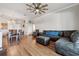 Open-concept living area with modern furniture, and hardwood floors at 2950 Inca Ave, Clermont, FL 34715