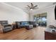 Comfortable living room with a ceiling fan and screened patio access at 2950 Inca Ave, Clermont, FL 34715