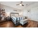 Comfortable main bedroom with hardwood floors, a ceiling fan and two closets at 2950 Inca Ave, Clermont, FL 34715