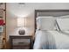 Relaxing main bedroom with a nightstand lamp and a decorative basket shelf at 2950 Inca Ave, Clermont, FL 34715
