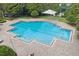 A sparkling community pool features lane markers and a brick-paved pool deck at 2950 Inca Ave, Clermont, FL 34715