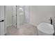 Modern bathroom featuring a freestanding tub and a separate glass-enclosed shower at 357 Marion Oaks Pass, Ocala, FL 34473