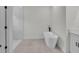 Bathroom featuring a freestanding tub and a separate glass-enclosed shower at 357 Marion Oaks Pass, Ocala, FL 34473