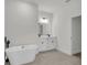 Bathroom features free standing soaking tub with tile flooring and dual sink vanity at 357 Marion Oaks Pass, Ocala, FL 34473