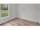 Bedroom showcases a bright window and new floors at 357 Marion Oaks Pass, Ocala, FL 34473